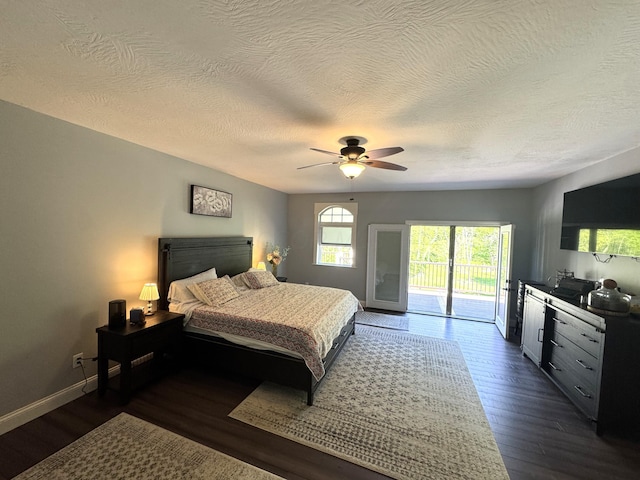 8610 Sadie Thomas Rd NW, Johnstown, OH 43031 - bedroom featuring access to outside, a textured ceiling, dark wood finished floors, baseboards, and ceiling fan