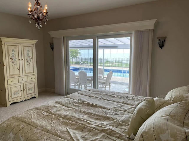 3348 W Erie Ave, Lorain, OH 44053 - bedroom with light colored carpet, a chandelier, and access to exterior