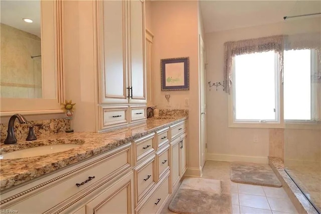 3348 W Erie Ave, Lorain, OH 44053 - bathroom with tile patterned floors, double vanity, a shower, and a sink