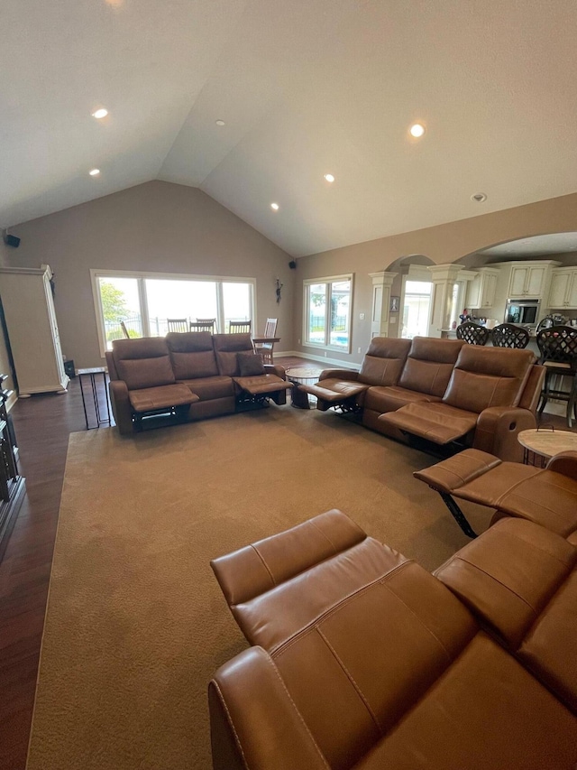 3348 W Erie Ave, Lorain, OH 44053 - living area featuring lofted ceiling, dark wood-type flooring, ornate columns, recessed lighting, and arched walkways