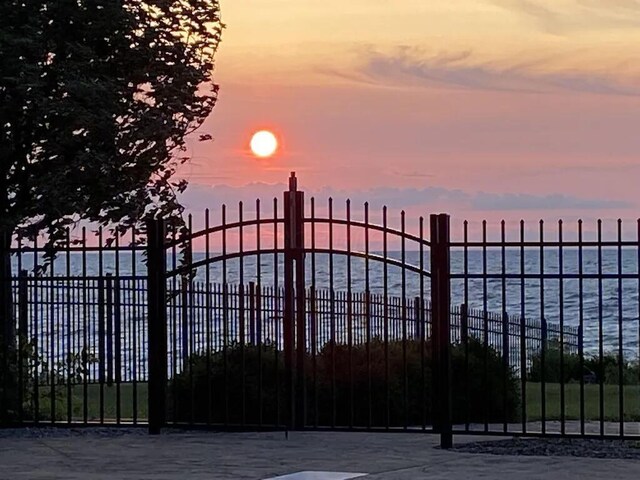 3348 W Erie Ave, Lorain, OH 44053 - gate at dusk with fence and a water view