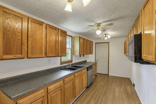 kitchen with a ceiling fan, stainless steel dishwasher, brown cabinetry, and a sink