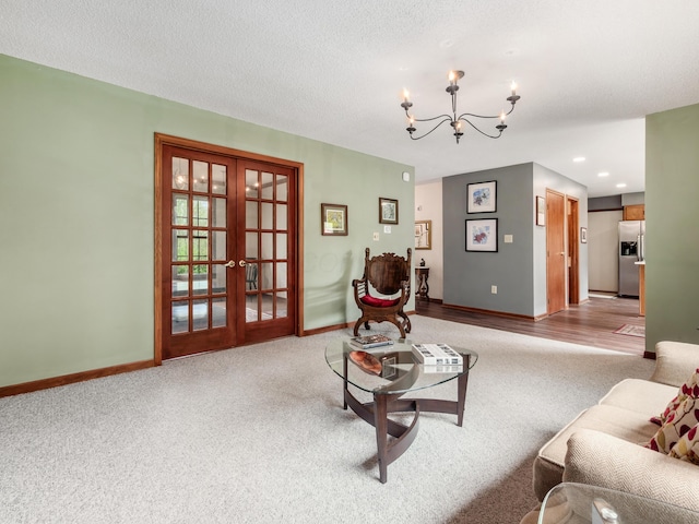 living room featuring carpet, a chandelier, french doors, baseboards, and recessed lighting