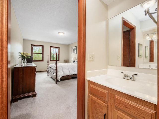 ensuite bathroom featuring vanity
