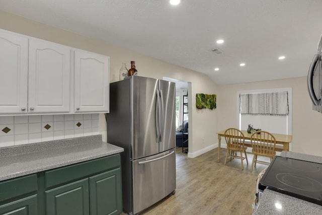 265 E St, Buckeye Lake, OH 43008 - kitchen featuring freestanding refrigerator, white cabinets, range with electric stovetop, backsplash, and recessed lighting
