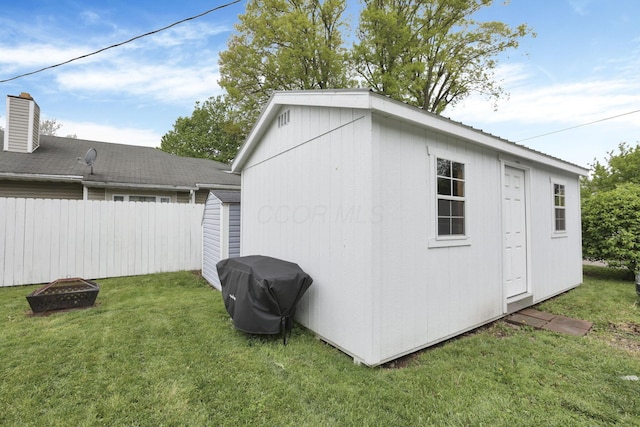 265 E St, Buckeye Lake, OH 43008 - view of shed with an outdoor fire pit