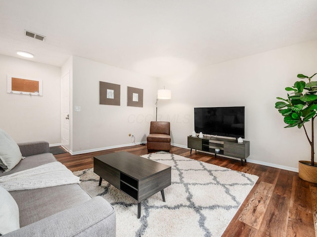 2059 Park Run Dr Unit D, Columbus, OH 43220 - living area featuring baseboards, visible vents, and wood finished floors