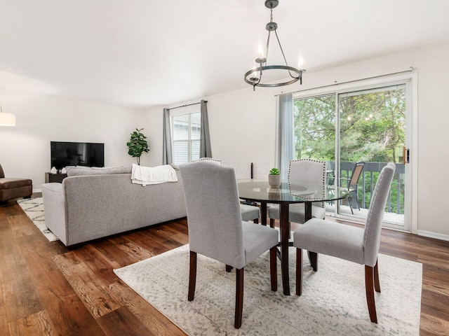 2059 Park Run Dr Unit D, Columbus, OH 43220 - dining area featuring a wealth of natural light, a notable chandelier, and wood finished floors