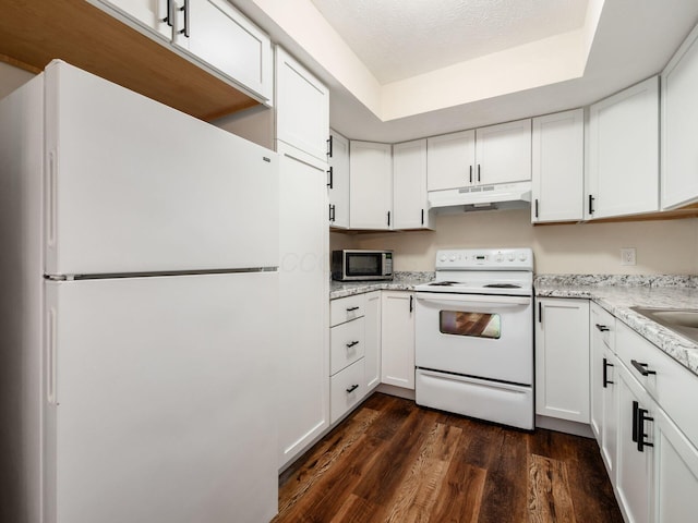 2059 Park Run Dr Unit D, Columbus, OH 43220 - kitchen with under cabinet range hood, white cabinetry, dark wood finished floors, and white appliances