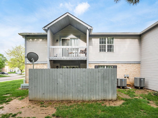 2059 Park Run Dr Unit D, Columbus, OH 43220 - rear view of house featuring a balcony, cooling unit, and brick siding