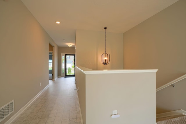 6332 Celeste St, Westerville, OH 43081 - hall featuring visible vents, an inviting chandelier, baseboards, recessed lighting, and an upstairs landing