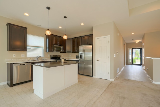 6332 Celeste St, Westerville, OH 43081 - kitchen featuring dark brown cabinetry, baseboards, recessed lighting, a sink, and appliances with stainless steel finishes