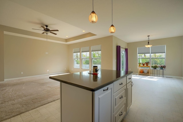 6332 Celeste St, Westerville, OH 43081 - kitchen with baseboards, open floor plan, white cabinetry, and a wealth of natural light