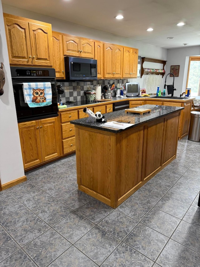 1305 Bald Hill Rd, Zanesville, OH 43701 - kitchen with black appliances, a kitchen island, dark stone countertops, brown cabinets, and recessed lighting
