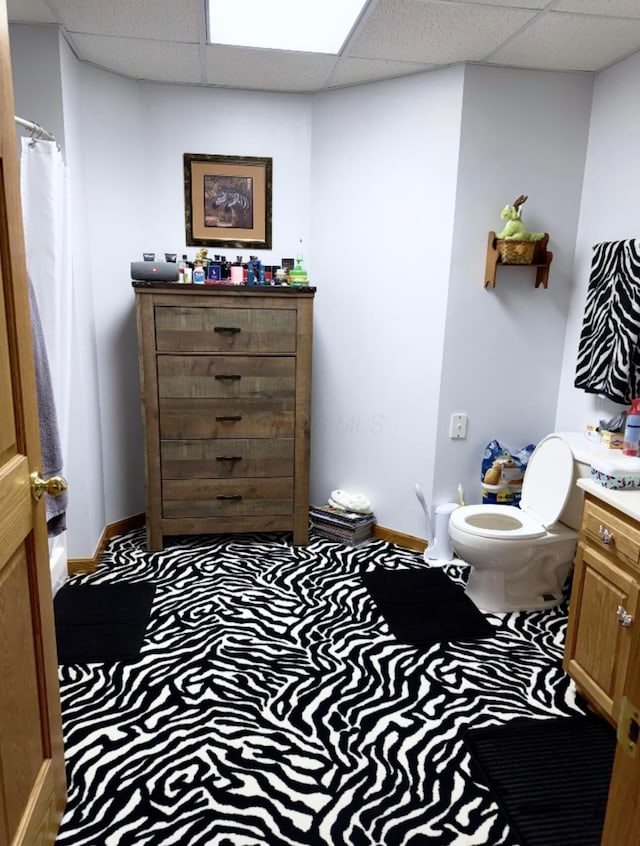 1305 Bald Hill Rd, Zanesville, OH 43701 - bathroom with vanity, a drop ceiling, baseboards, toilet, and a shower with shower curtain