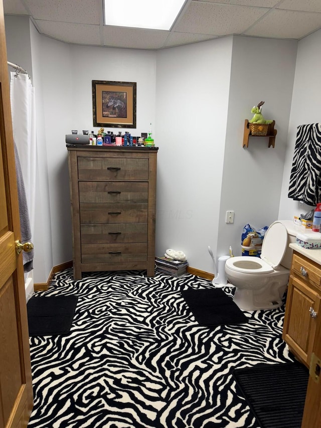 1305 Bald Hill Rd, Zanesville, OH 43701 - bathroom with a drop ceiling, baseboards, vanity, and toilet