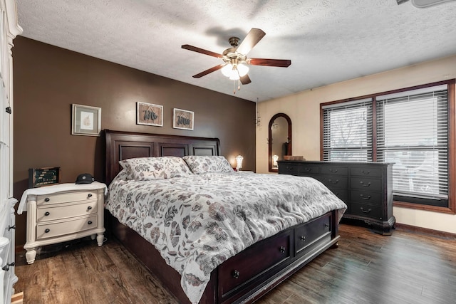 1702 Valley Forge Dr, Lancaster, OH 43130 - bedroom with a textured ceiling, dark wood-type flooring, baseboards, and a ceiling fan