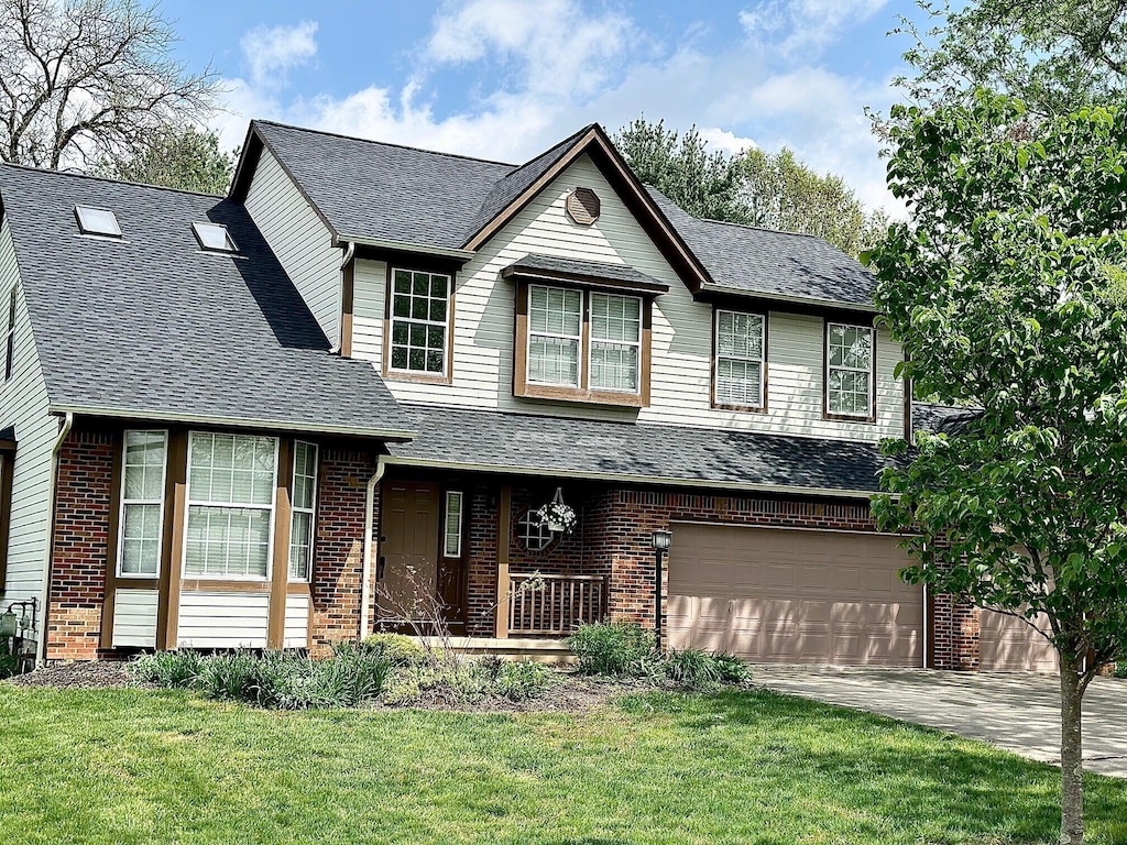 view of front of property featuring brick siding, a garage, roof with shingles, and driveway