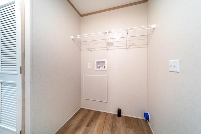 washroom with washer hookup, laundry area, electric dryer hookup, wood finished floors, and baseboards