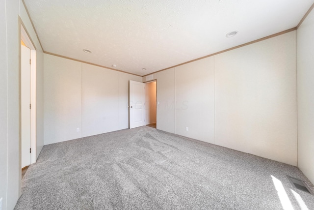 unfurnished bedroom featuring ornamental molding, carpet, and recessed lighting