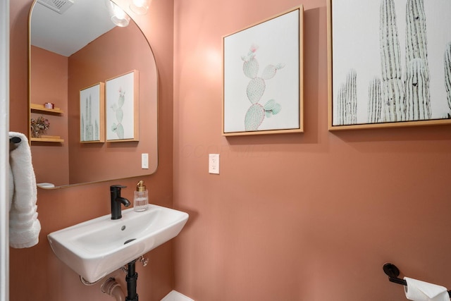 bathroom with a sink and visible vents