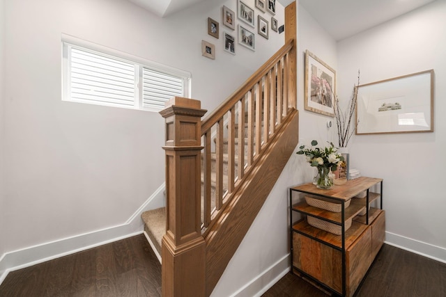 stairs with baseboards and wood finished floors