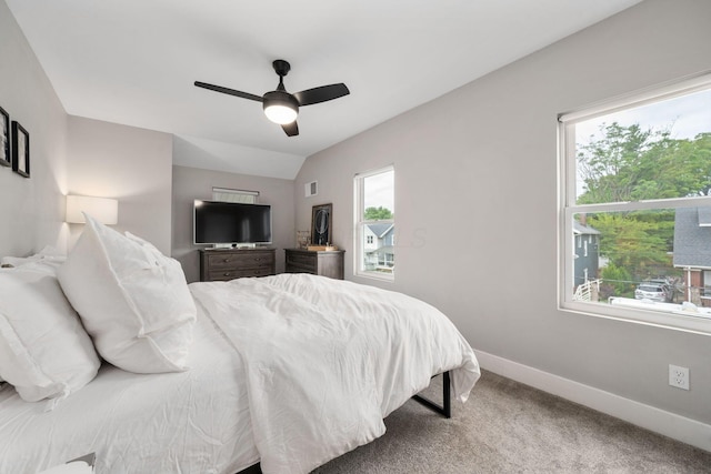 bedroom featuring baseboards, ceiling fan, carpet, and lofted ceiling