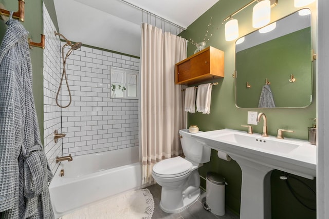 bathroom featuring toilet, tile patterned floors, and shower / bath combination with curtain