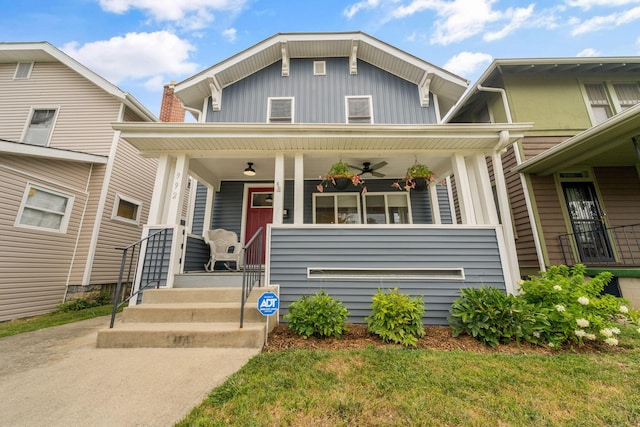 view of front of house with a porch, a ceiling fan, and board and batten siding