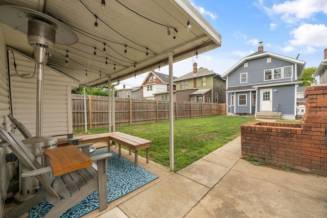 view of patio with a fenced backyard and a residential view