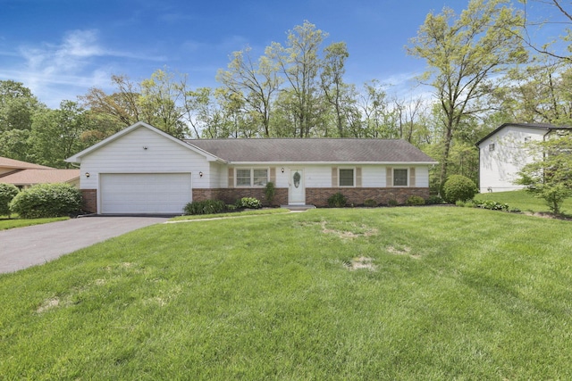 ranch-style house with an attached garage, a front lawn, brick siding, and driveway
