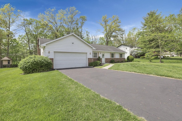 ranch-style house featuring a garage, a front lawn, brick siding, and driveway