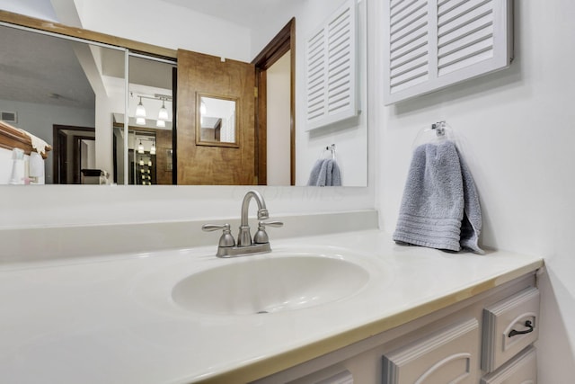 bathroom with visible vents and vanity