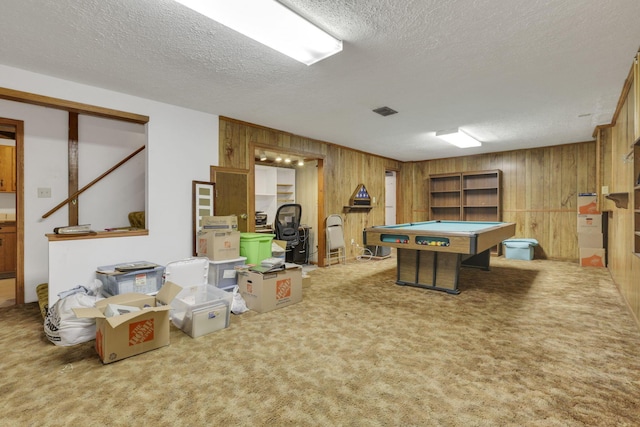 playroom featuring visible vents, wood walls, a textured ceiling, pool table, and carpet