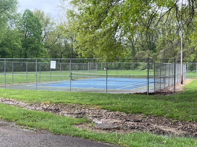view of sport court with fence