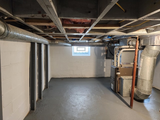 basement featuring heating unit