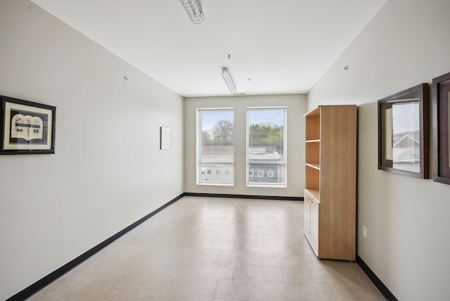empty room with baseboards