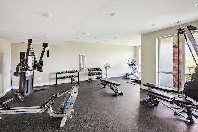 exercise room featuring baseboards
