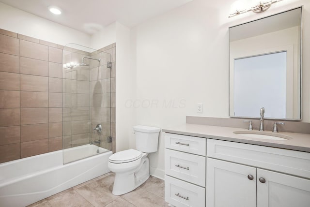 bathroom featuring toilet, tile patterned flooring, vanity, and shower / bath combination
