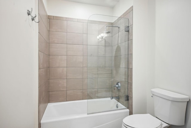 bathroom with toilet and washtub / shower combination