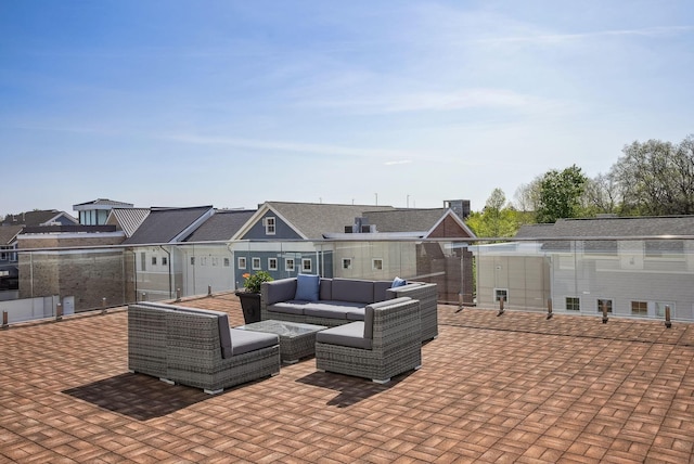 view of patio with an outdoor living space and a residential view