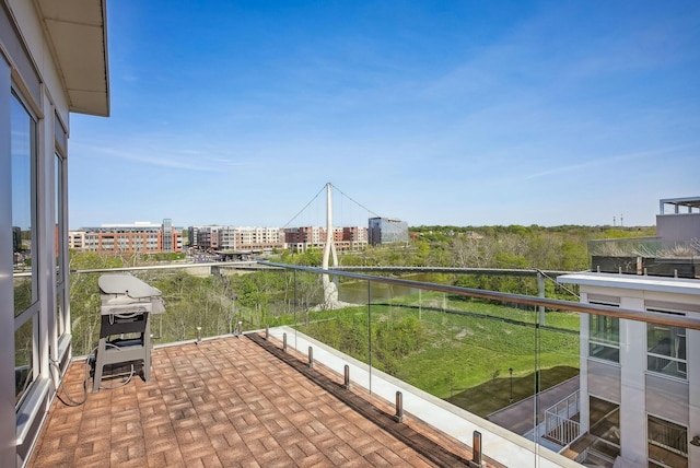 balcony with grilling area and a city view