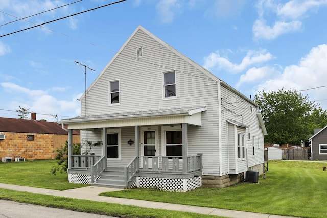 view of front of home featuring covered porch, central air condition unit, and a front lawn