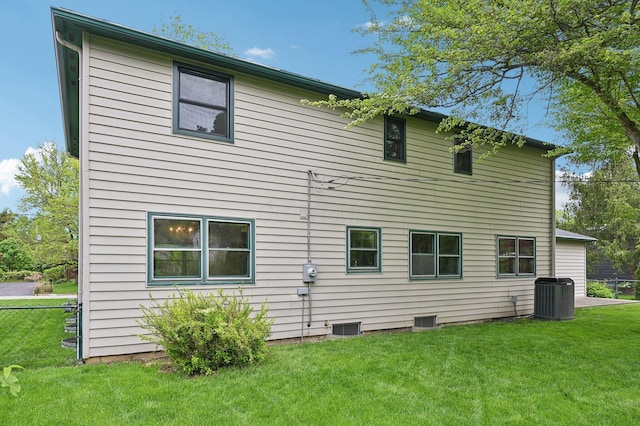 rear view of property featuring central AC