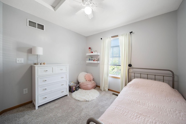 carpeted bedroom with visible vents, baseboards, and ceiling fan