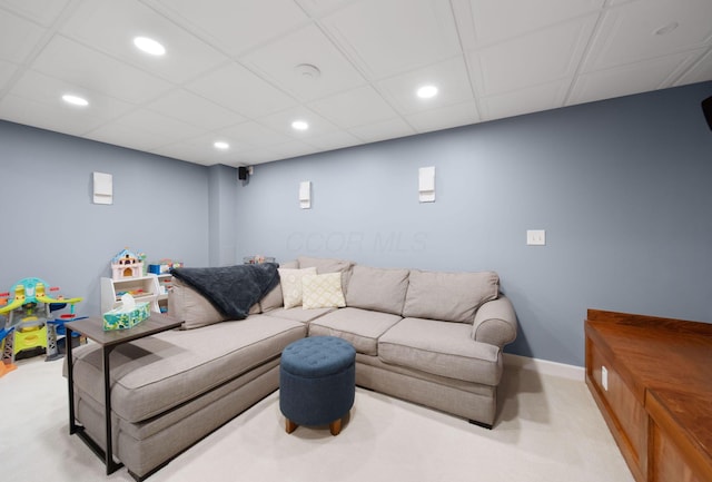 living area with a paneled ceiling, light carpet, baseboards, and recessed lighting