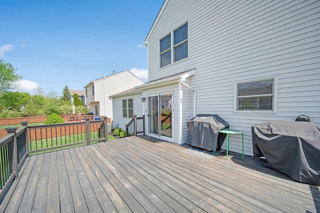 wooden deck featuring grilling area and fence