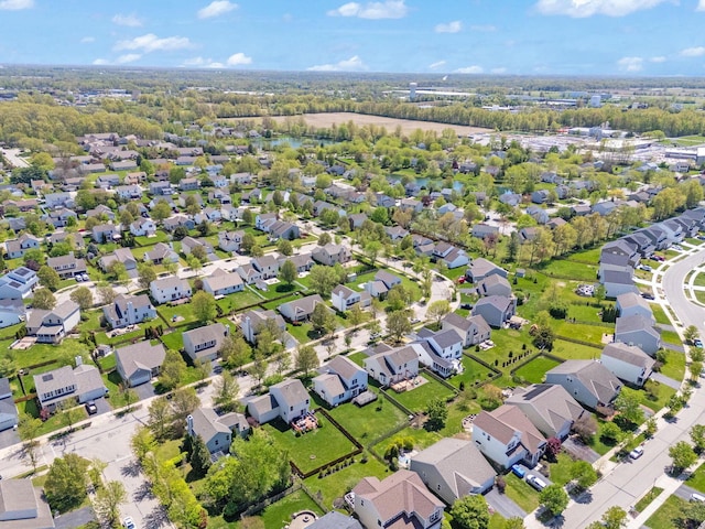 birds eye view of property with a residential view