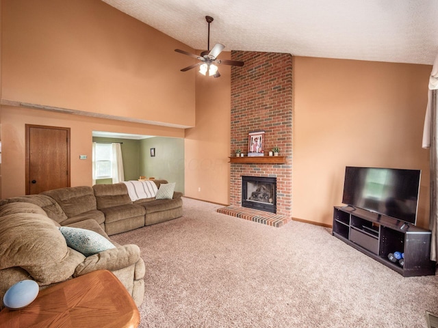 living area with high vaulted ceiling, a fireplace, a ceiling fan, and carpet floors