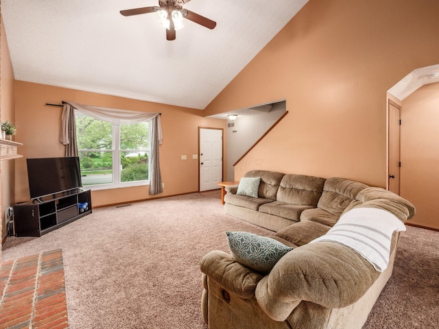 living area with carpet flooring, a ceiling fan, visible vents, baseboards, and stairs
